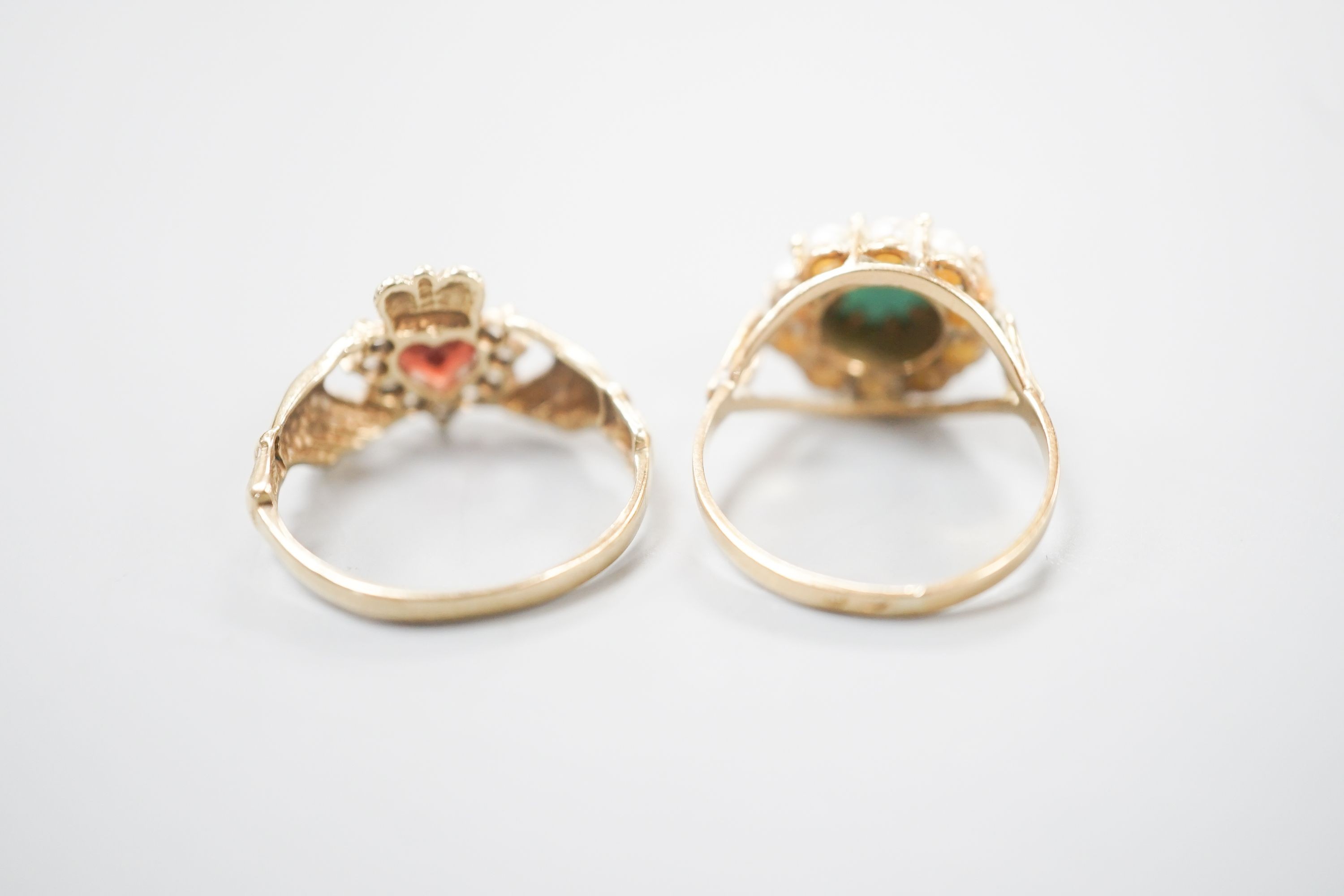 A 9ct gold and gem set claddagh ring, size L, gross 2.2 grams and a yellow metal, turquoise and seed pearl ring, gross 3 grams.